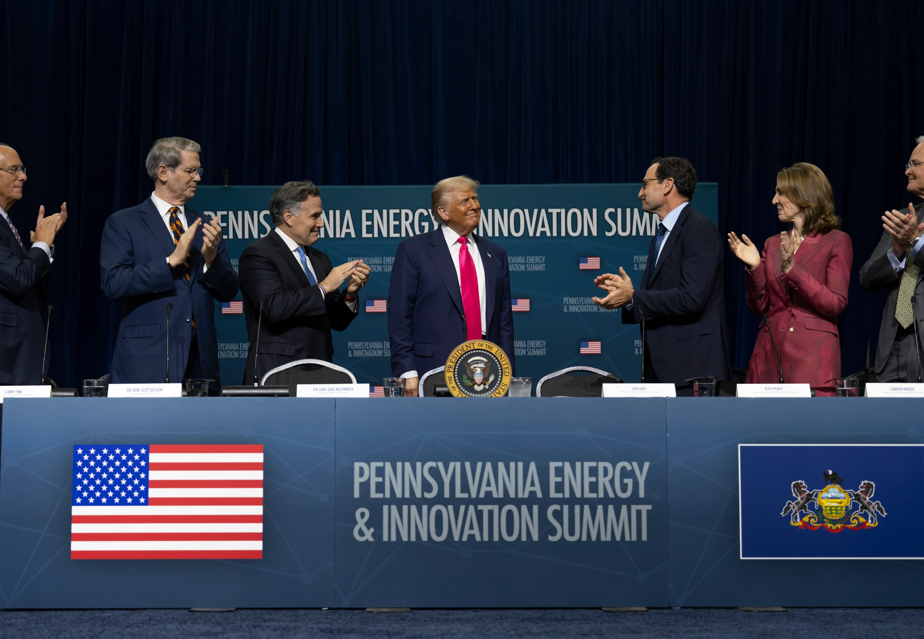 The U.S. government's AI Action Plan aims to maintain leadership in AI by boosting funding, fostering public-private collaboration, and emphasizing open-source models aligned with American values